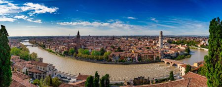 Photo for Verona cityscape panoramic aerial view on the riverside with historical buildings, towers, and bridge Ponte Pietra. Verona, Italy. High resolution image. - Royalty Free Image