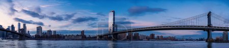 Photo for Brooklyn and Manhattan Bridge panoramic skyline view at sunset. New York City. High resolution image made by different photos stitched together. - Royalty Free Image