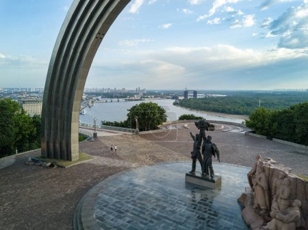 Photo for KIEV, UKRAINE - MAY, 2019:  Arch and Monument of Friendship of Nations in the central park over Dnepr River. Aerial view. - Royalty Free Image