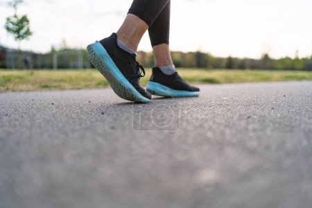 Photo for Detail of young woman runner shoes from the back. - Royalty Free Image