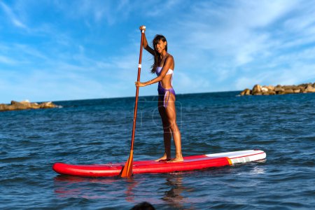 Photo for Young woman portrait with Paddle Board - Royalty Free Image