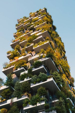 Photo for MILAN, ITALY - SEPTEMBER 2016: Vertical gardens skyscraper with trees growing on balconies, built for Expo 2015. - Royalty Free Image