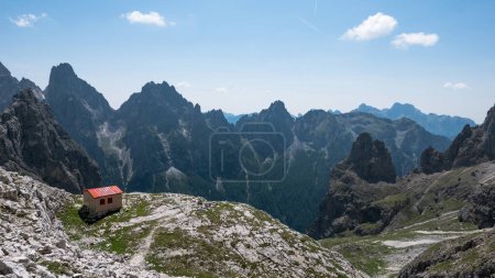 Photo for Panoramic view of Dolomites mountains with small refuge, Italy. - Royalty Free Image
