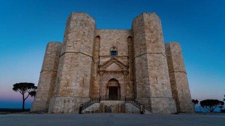 Photo for Castel del Monte at sunshine, the famous castle built in an octagonal shape by the Holy Roman Emperor Frederick II in the 13th century in Apulia, Italy. World Heritage Site since 1996. - Royalty Free Image