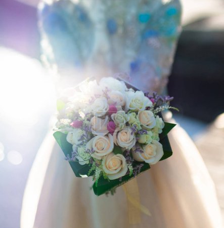 Photo for Close up of a beautiful wedding bouquet with yellow, white, pink, crimson roses. Woman holding flower. High quality photo. - Royalty Free Image