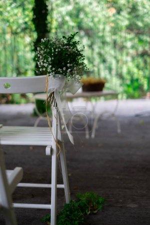 Photo for Wedding decoration. White stools for bride and groom. Nuptial ceremony outdoors. - Royalty Free Image