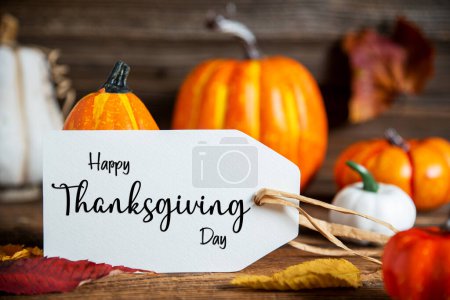 Photo for Autumn Decoration With Orange Pumpkins, Rustic fall Decoration With Label Text Happy Thanksgiving Day - Royalty Free Image