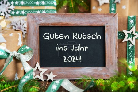 Foto de Texto alemán Guten Rutsch Ins Jahr 2024, Significa Feliz Año Nuevo 2024 En Inglés Y Verde, Decoración de Navidad Sostenible, Decoración de Invierno, Ecológico - Imagen libre de derechos