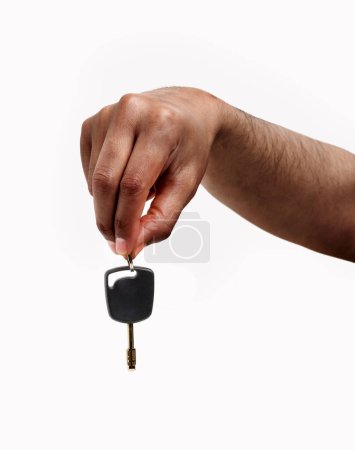 Photo for Man hand giving a car key isolated on a white background - Royalty Free Image