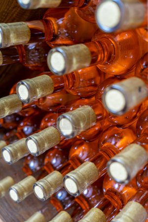 Téléchargez les photos : A bottle of Ros wine among other bottles - en image libre de droit