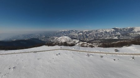 Photo for Stara Planina Babin Zub mountain in serbia covered with snow with road in winter day panorama tourist destination and ski center in Serbia road against the mountain peak - Royalty Free Image