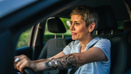 Photo for One woman mature caucasian senior drive car angry frustrated negative emotion traffic conflict negative face expression annoyed driver real person copy space - Royalty Free Image