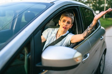 Photo for One woman mature caucasian senior drive car angry frustrated negative emotion traffic conflict negative face expression annoyed driver real person copy space - Royalty Free Image
