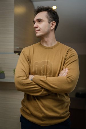 Photo for Portrait of young adult caucasian man standing at home wear sweater - Royalty Free Image