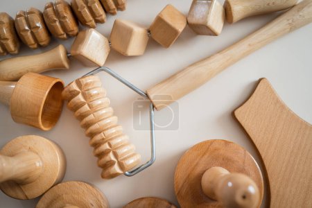 Photo for Wood massage maderotherapy madero therapy wooden rolling pin or battledore tools for anti cellulite treatment to stimulate the lymphatic system and improve circulation concept - Royalty Free Image