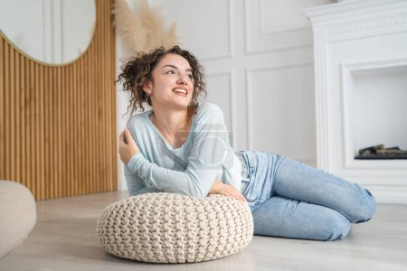Photo for One woman young caucasian female happy smile on the floor at home - Royalty Free Image