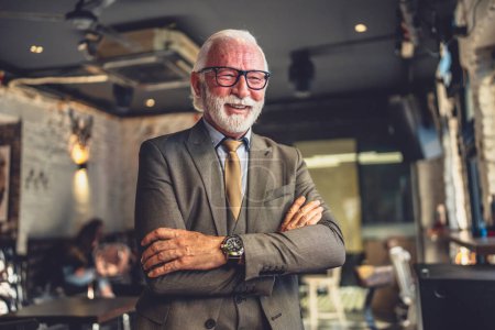 Photo for Portrait of one senior man businessman stand in cafe or restaurant - Royalty Free Image
