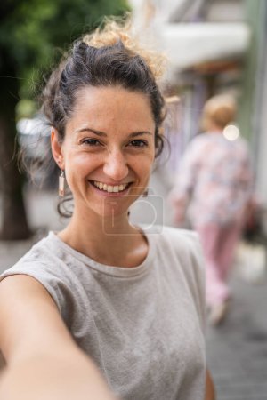 Photo for Portrait of adult caucasian woman stand in town or city outdoor in day happy smile confident carefree - Royalty Free Image