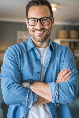 Photo for One man adult portrait of caucasian male with beard and eyeglasses stand at home happy smile copy space - Royalty Free Image