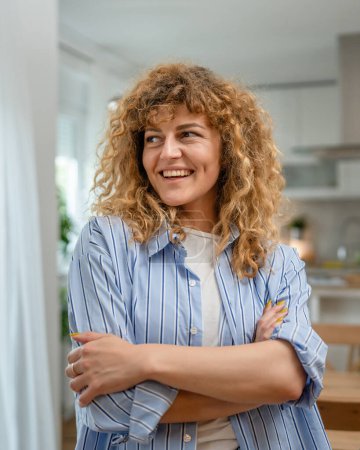 Photo for Portrait of one adult caucasian woman at home happy smile curly hair - Royalty Free Image