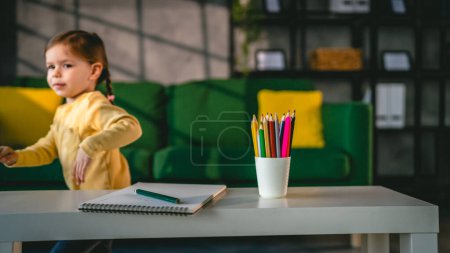 Photo for Toddler girl caucasian child play with crayons at home - Royalty Free Image