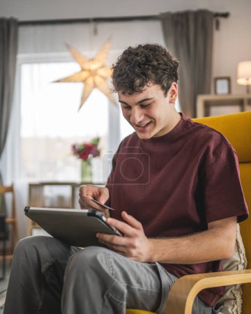 Photo for One teenager young man caucasian male sit at home use credit card shopping online use internet for online purchase active modern e-banking - Royalty Free Image