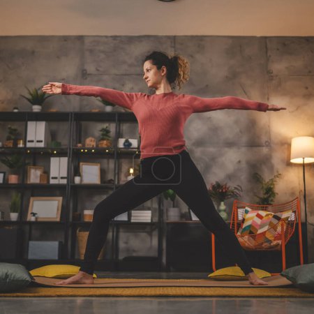 Photo for Woman caucasian female practice yoga on mat in living room at home - Royalty Free Image