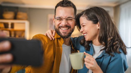Photo for Self portrait selfie of happy couple husband and wife boyfriend and girlfriend or brother and sister happy smile at home - Royalty Free Image
