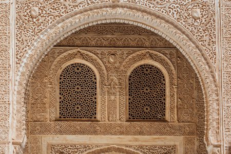 Photo for Marble capitals and stucco decoration of the portico in Patio del Cuarto Dorado in Mexuar in Comares Palace Alhambra, Andalusia, Spain. Magic breathtaking carved decoration  in orient style. - Royalty Free Image
