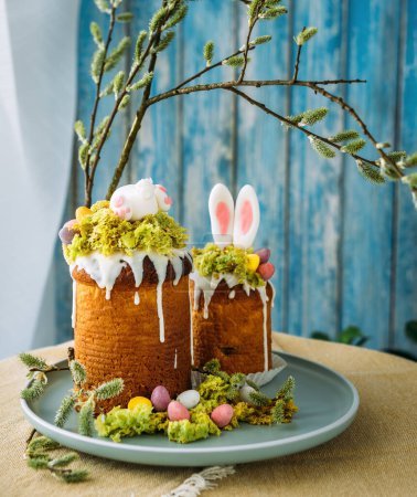 Paska - the Easter Eve sweet bread with icing decorated with eatable "moss" still life. Popular dessert during Eastern Orthodox Easter Holiday. Old cultures traditions and healthy eating concept image