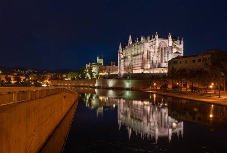 Palma Cathedral Catedral de Santa Mara de Palma de Mallorca  one of the highest Gothic choir in the world 44m with reflection in park pond during sunset evening time blue hours