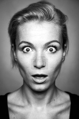 Photo for Surprised expression on the young woman's face. - Royalty Free Image