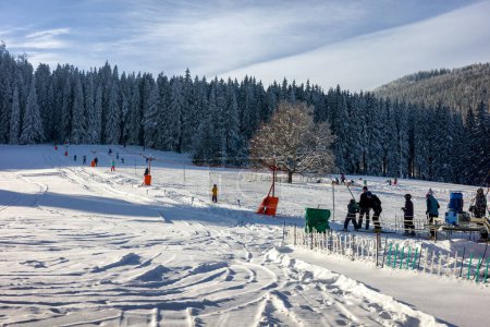 Photo for Liptovska Luzna, Slovakia - January 29, 2023: People on small ski-lift in village Zelezno, SLovakia - Royalty Free Image