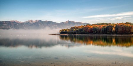 Photo for Long exposure autumn panoramic  landscape. Lake Liptovska Mara and Western Tatras in Slovakia - Royalty Free Image
