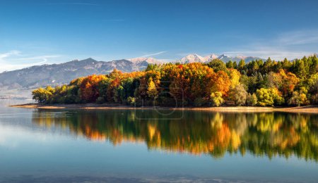 Photo for Panoramic autumn landscape. Colorful trees, lake and mountains at background. Lake Liptovska Mara in Slovakia - Royalty Free Image