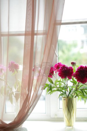Photo for Pink peony on window sill - Royalty Free Image