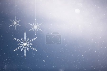 Photo for Snowflakes hanging on the string with snowfall decoration winter scene greetings card copy space illustration background. - Royalty Free Image