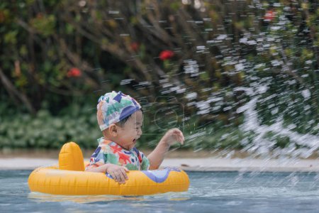 Photo for Boy enjoying playing water on pool - Royalty Free Image