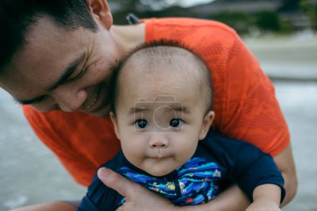 Photo for Young father and his adorable little baby - Royalty Free Image