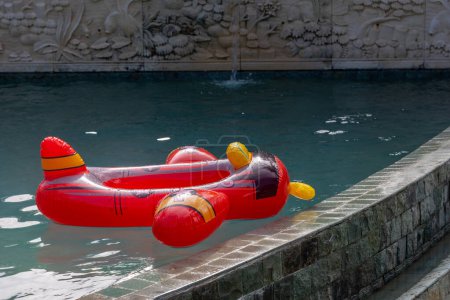 Photo for Inflatable float rubber ring in the shape of aeroplane for kids use - Royalty Free Image