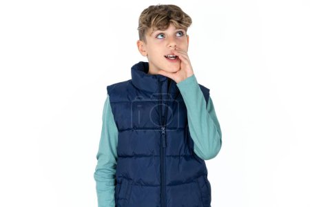 Photo for Handsome Caucasian teen boy in blue vest hear incredible private news impressed scream share - Royalty Free Image