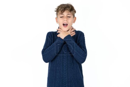 Photo for Handsome Caucasian teen boy in blue sweater shouting suffocate because painful strangle. Health problem. Asphyxiate and suicide concept. - Royalty Free Image