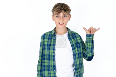 Photo for Handsome teen boy wearing plaid shirt over white background showing up number six Liu with fingers gesture in sign Chinese language - Royalty Free Image