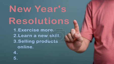 Photo for 2023 Happy New Year Resolution Goal List, Hand pointing on plan listing of new year goals and resolutions setting. Change and determination concept.. - Royalty Free Image