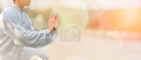 Photo for Asian man workout with Tai Chi in the morning at the park, Chinese martial arts, healthy care for healthy life concept. - Royalty Free Image