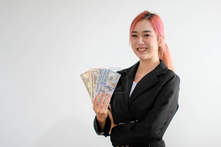 Photo for Asian businesswoman holding money - Royalty Free Image