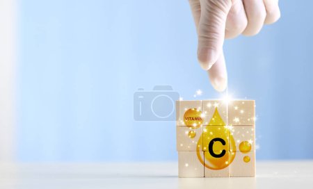 Photo for Wood blocks with Vitamin C on it. symbol of the need for vitamins - Royalty Free Image