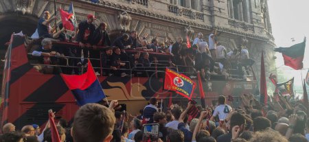 Photo for GENOA, ITALY, MAY 6,2023 - Genoa cfc team football supporters celebrate the promotion in italian Serie A in De Ferrari Square upon arrival of the team on an open top bus Genoa, Italy - Royalty Free Image