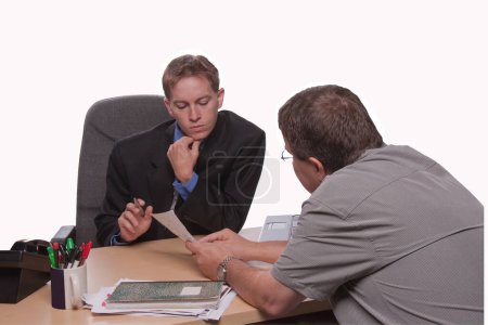 Photo for A young man and an older man having a business discusion - Royalty Free Image