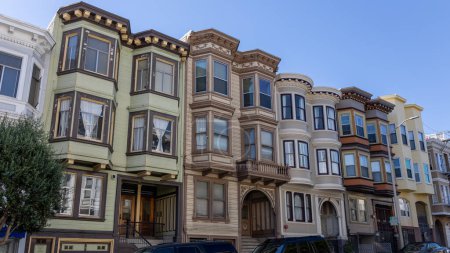 Photo for Beautiful Victorian houses painted in multiple colors on a street in the city of San Francisco, California, USA - Royalty Free Image